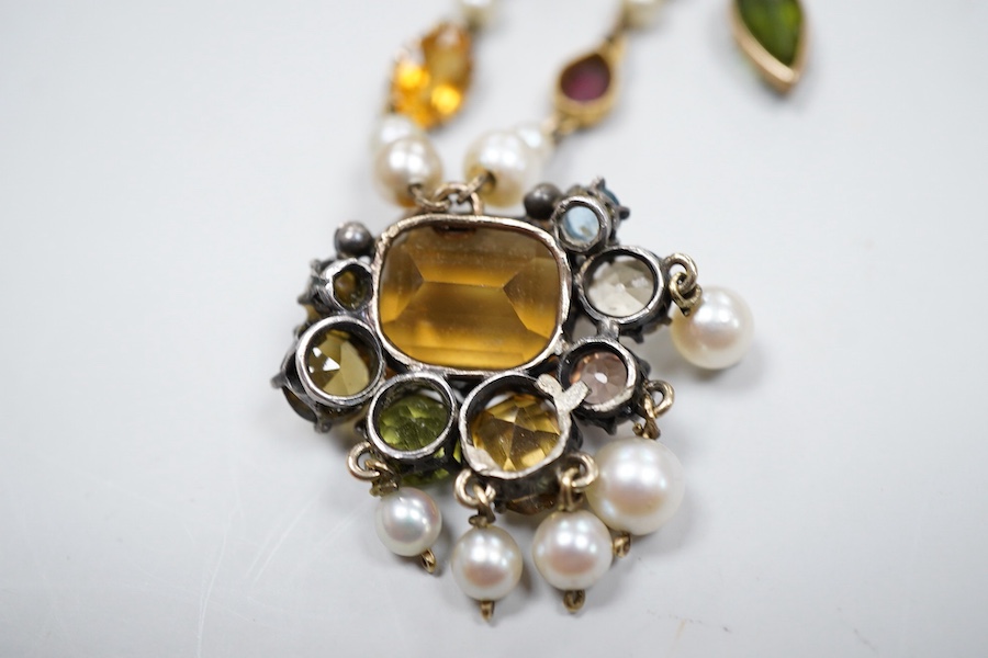 An Arts & Crafts gem-set and pearl necklace, circa 1900, composite, set with variously cut stones including citrine, amethyst, peridot, tourmaline and zircon, and pearls, length 42cm, pearls untested, Condition: good, ty
